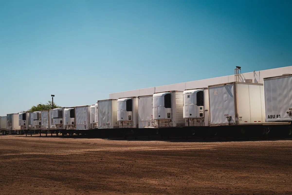 Refrigerated trailers backed up to a warehouse loading dock