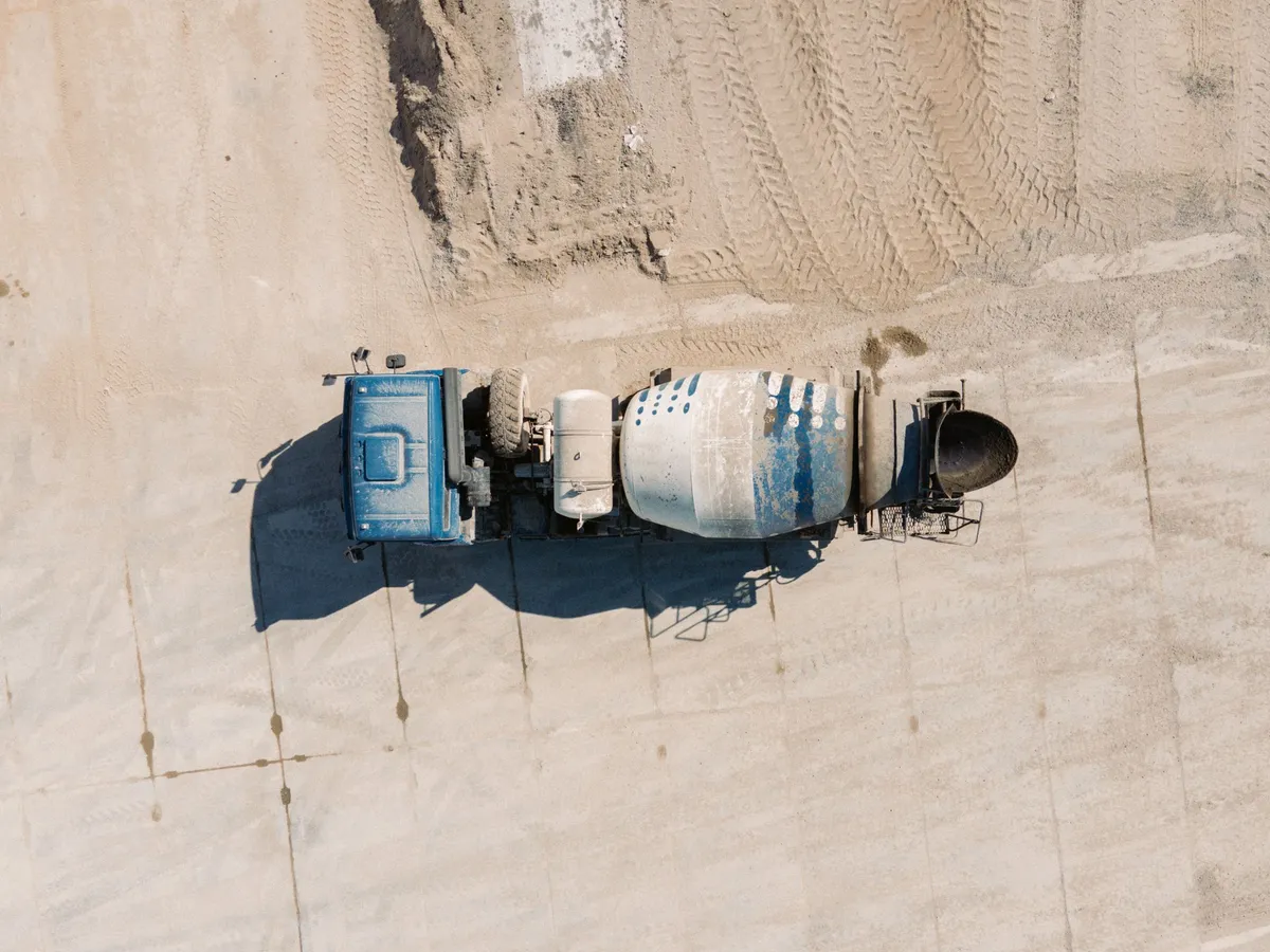 Aerial view of a ready-mix concrete mixer truck, drum visible